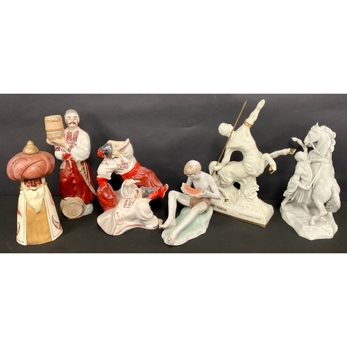 366 - A Herend porcelain model, of a Cossack with rearing horse, in white, 25cm high,a/f; a Zsolnay model,... 