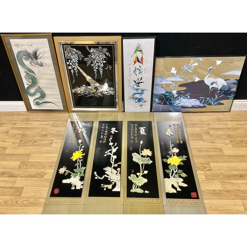 396 - Interior Decoration - a set of four Chinese rectangular panels, decorated in relief with composite s... 