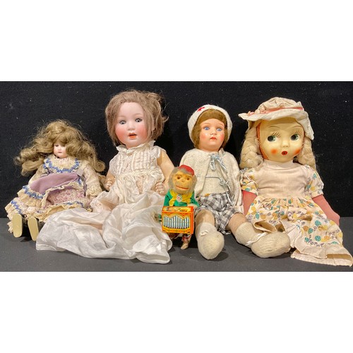 410 - An Armand & Marseille bisque head doll, fixed blue eyes, 32cm high; a Porzellanfabrik Mengersgereuth... 