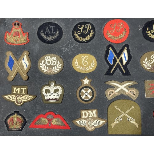 5171 - British Army Cloth Trade, Qualification and Rank Insignia. 28 items fixed to a display board. Includ... 