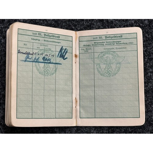 5251 - WW2 Third Reich Polizei Dienstpass to Johannes Rose. Dated 1941 with entries to 1944. Complete with ... 