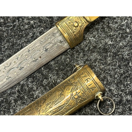 5274 - Two Middle Eastern Jambiya Daggers. Each made of brass and with inlaid Horn grips. Both with curved ... 