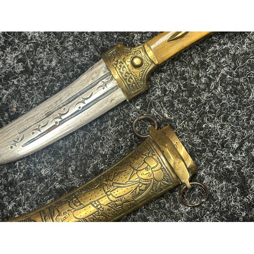 5274 - Two Middle Eastern Jambiya Daggers. Each made of brass and with inlaid Horn grips. Both with curved ... 