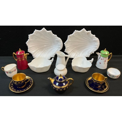 192 - A Coalport cobalt blue and gilt miniature tea pot, similar cups and saucers, red and gilt coffee pot... 