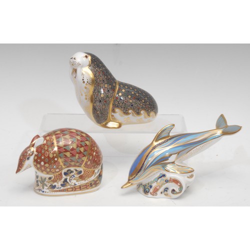 3071 - A Royal Crown Derby paperweight, Dolphin, silver stopper, 18cm long; others, Russian Walrus, silver ... 