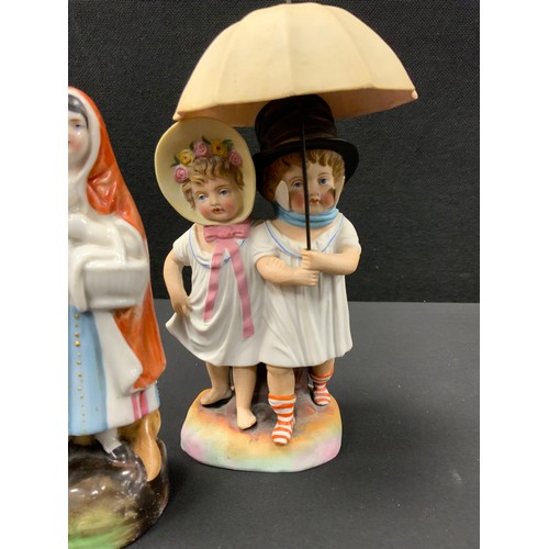 38 - A pair of Art deco bookends of cricket-playing dogs, c.1920, German bisque figure group, Royal Stanl... 