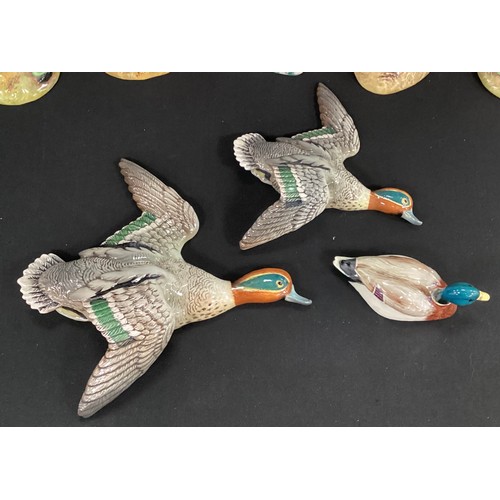 54 - A graduated pair of Beswick Teal Duck wall plaques, comprising model nos 1530-1 and 1530-3, printed ... 