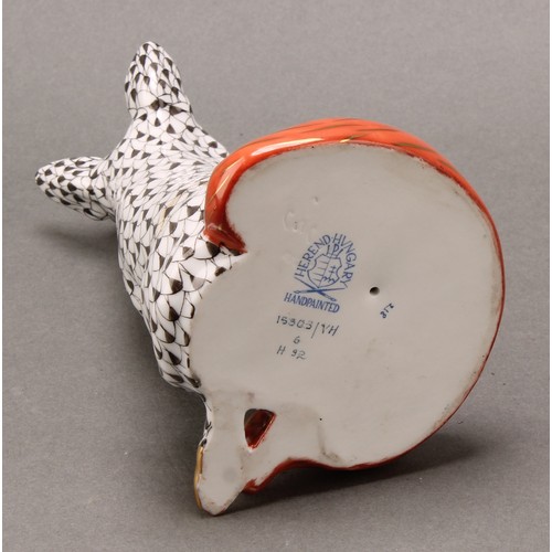 4068 - A Herend porcelain model, of a seated fox, painted in black fishnet pattern, orange tail, picked out... 