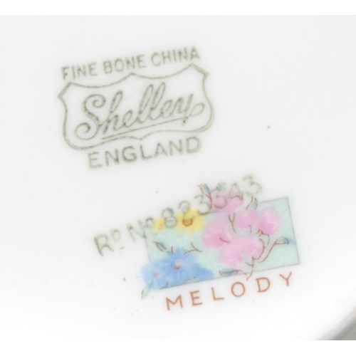 4014 - A Shelley Melody pattern part tea and coffee service for six, printed with chintz blossom (qty)