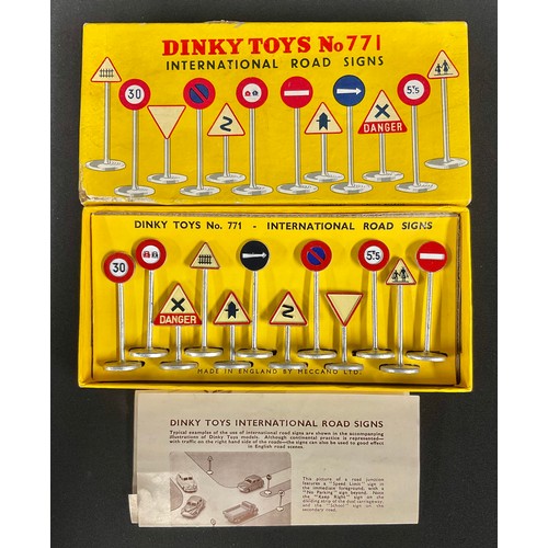 5190 - Toys & Juvenalia - a mid-century boxed set of twelve Dinky Toys International Road Signs, No. 771, t... 