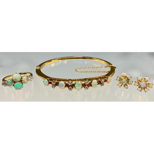 6281 - Opal and diamond gold jewellery, including a bangle, a ring and a pair of earrings - the bangle set ... 