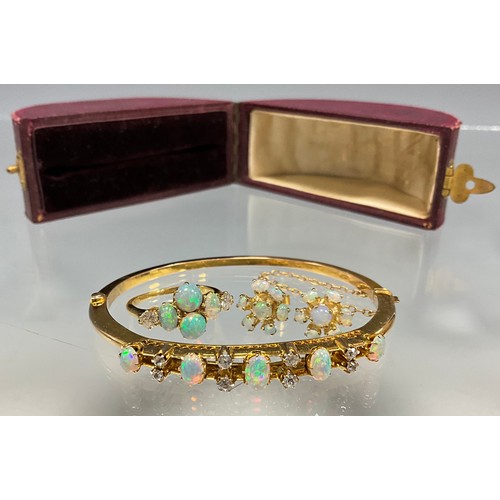 6281 - Opal and diamond gold jewellery, including a bangle, a ring and a pair of earrings - the bangle set ... 