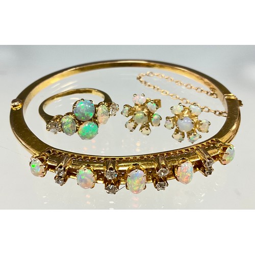 6281 - Opal and diamond gold jewellery, including a bangle, a ring and a pair of earrings - the bangle set ... 