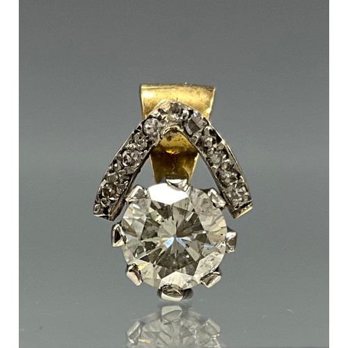 6244 - An 18ct gold solitaire diamond pendant with diamond surround, the pendant set with an approx. 1.00ct... 