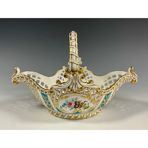 6295 - A 19th century Minton porcelain basket bowl, painted with Roses and wild flowers, within pierced bas... 
