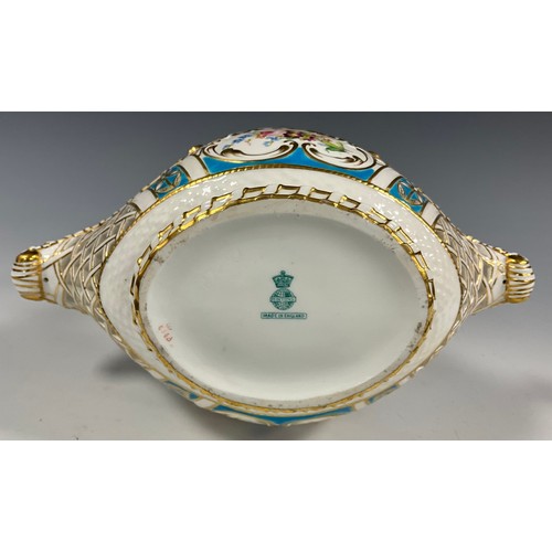 6295 - A 19th century Minton porcelain basket bowl, painted with Roses and wild flowers, within pierced bas... 