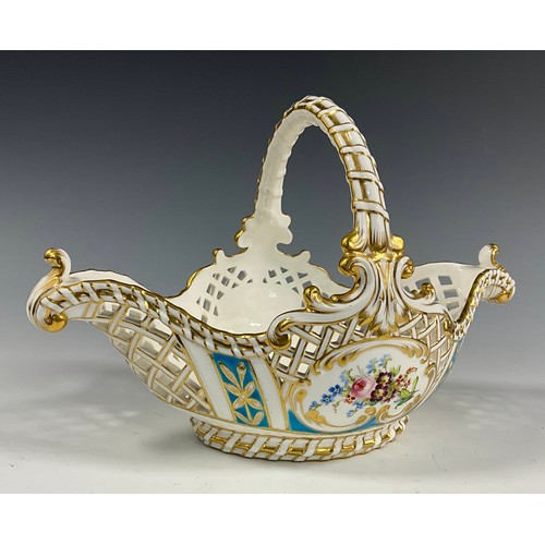 6295 - A 19th century Minton porcelain basket bowl, painted with Roses and wild flowers, within pierced bas... 