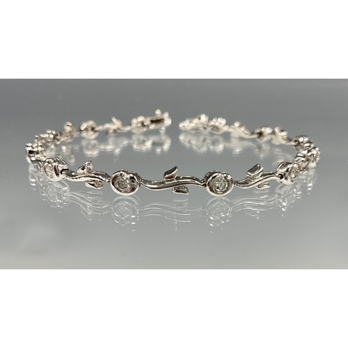 6249 - An 18ct white gold Art Nouveau Style diamond bracelet, set with twelve melee round brilliant cut dia... 