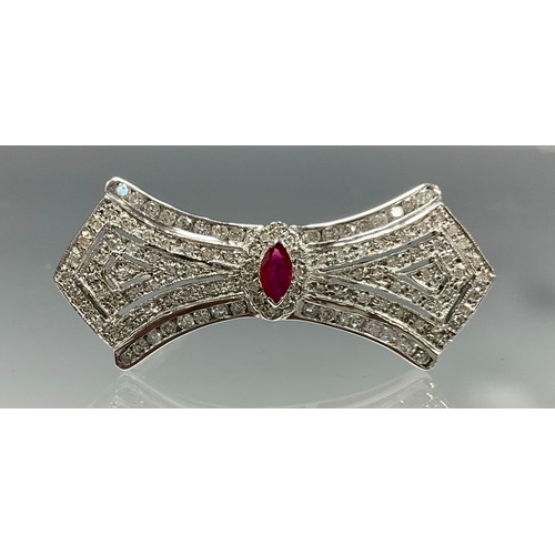 6262 - An Art Deco Style 18ct white gold ruby and diamond brooch, set with a marquise cut ruby to centre me... 