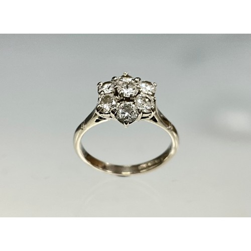 6250 - An 18ct white gold diamond cluster ring, set with seven round brilliant cut diamonds, total diamond ... 