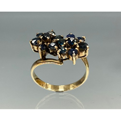 6242 - An 18ct gold sapphire double flower design cluster ring, set with seven round brilliant cut sapphire... 