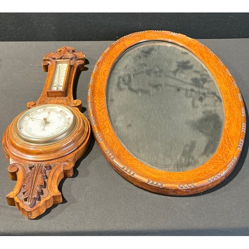 5211 - A 19th century American walnut drop-dial wall clock, 89cm high; an early 20th century carved oak wal... 