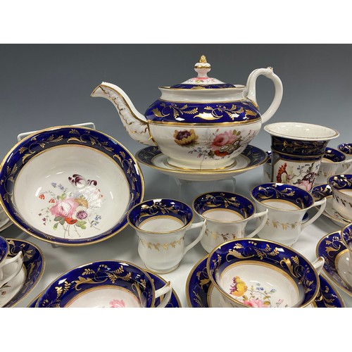 6294 - A 19th century English tea service for eight, painted to the central reserves with a floral arrangem... 