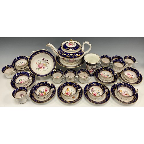 6294 - A 19th century English tea service for eight, painted to the central reserves with a floral arrangem... 