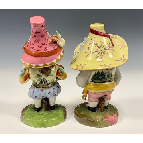 6307 - A pair of Royal Crown Derby style Mansion House Dwarfs, decorated in typical fashion, 13cm, and 14cm... 