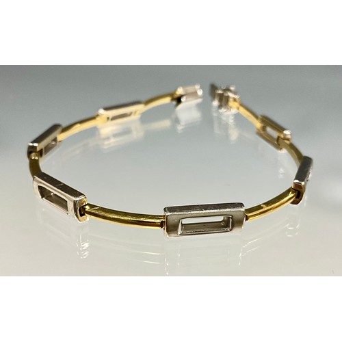6248 - An 18ct two tone yellow and white gold alternating link bracelet, Sheffield import marks, stamped 75... 