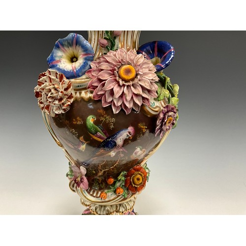 6298 - A Coalbrookdale pedestal vase, everted gilt rim above two panels hand-painted with still life and ex... 