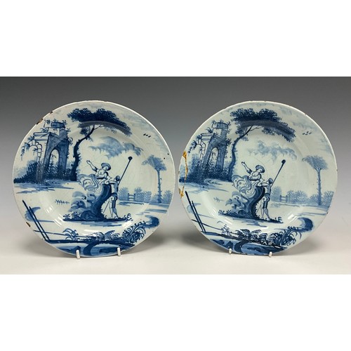6305 - A pair of 18th century English Bristol Pottery Delft plates, hand-painted Shepherd and Shepherdess p... 
