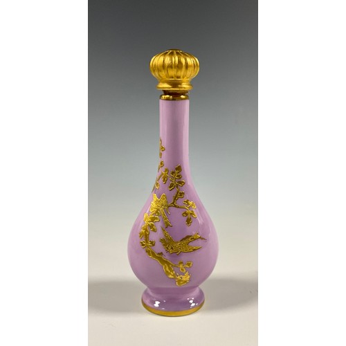 6303 - A Lynton porcelain tear-shaped scent bottle, decorated in gilt with birds among blossoming prunus on... 
