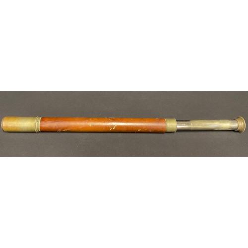 5183 - A late 19th/early 20th century brass telescope, brown leather grip, 45cm closed