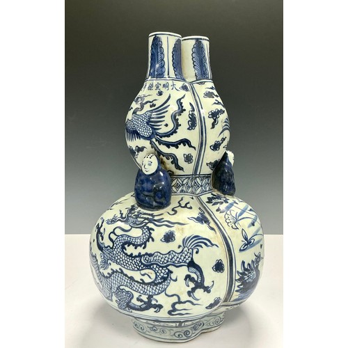 5031 - A large Chinese blue and white vase, of Ming design, 41cm high