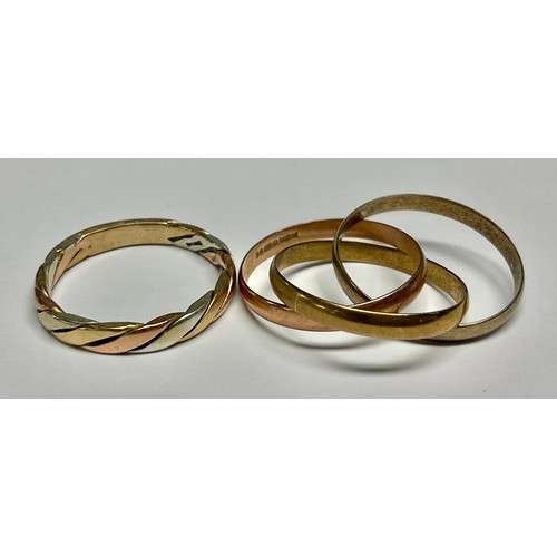 A 9ct three colour band; a 9ct gold three colour interlinked three band ...