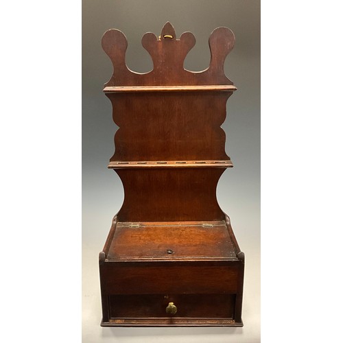 44 - A George III oak spoon rack, possibly Welsh, shaped cresting above to rows of slots, the deep base w... 