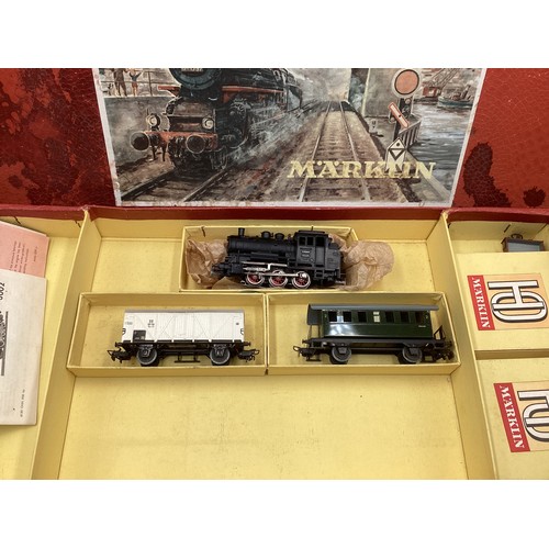 3066 - A Märklin HO steam locomotive train set, model Railway interest vintage boxed pieces boxed; a Markli... 