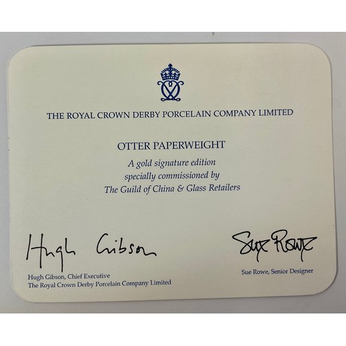 3135 - A Royal Crown Derby paperweight, Otter, a gold signature edition, specially commissioned by The Guil... 