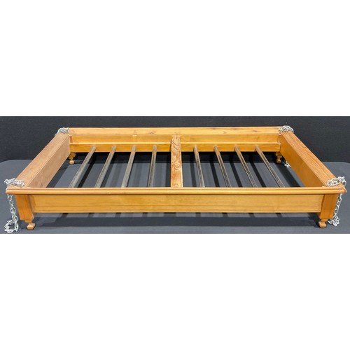 A pine kitchen rack for suspending a 