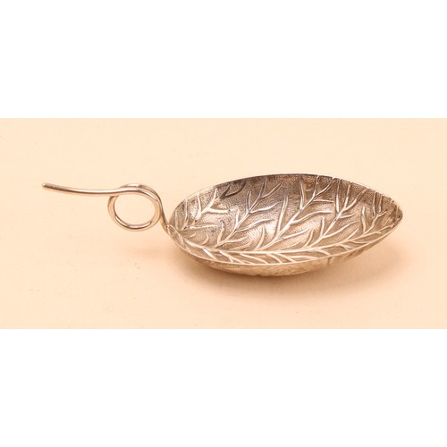 A George III silver leaf shaped caddy spoon, loop handle, apparently ...