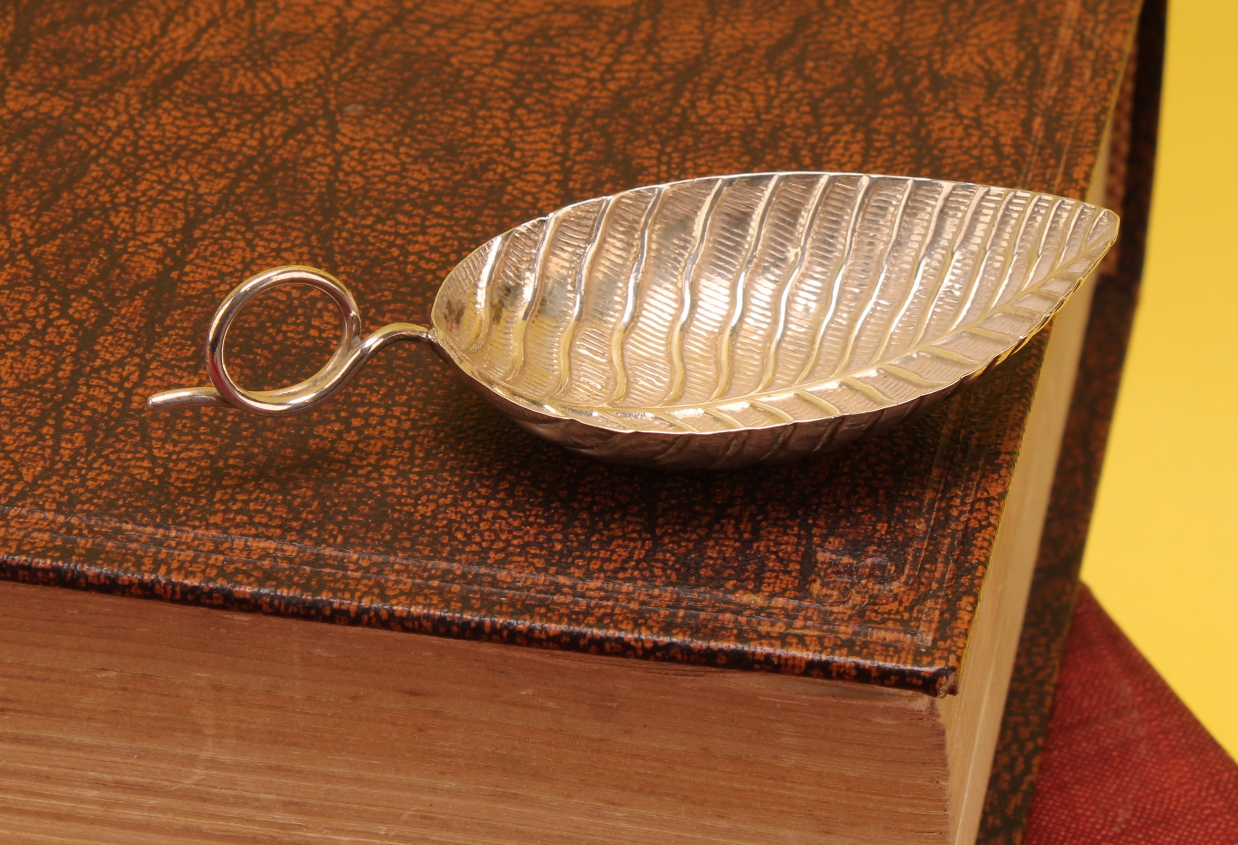 A George III silver leaf shaped caddy spoon, loop handle, 7.5cm long ...