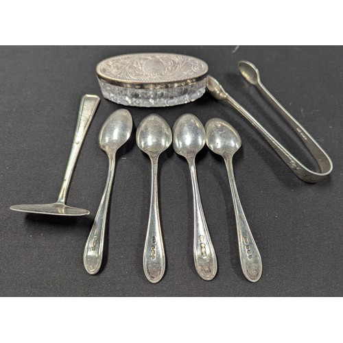 5040 - A set of four George V silver teaspoons, Sheffield 1932, 52.6g; a pair of silver sugar bows, a silve... 