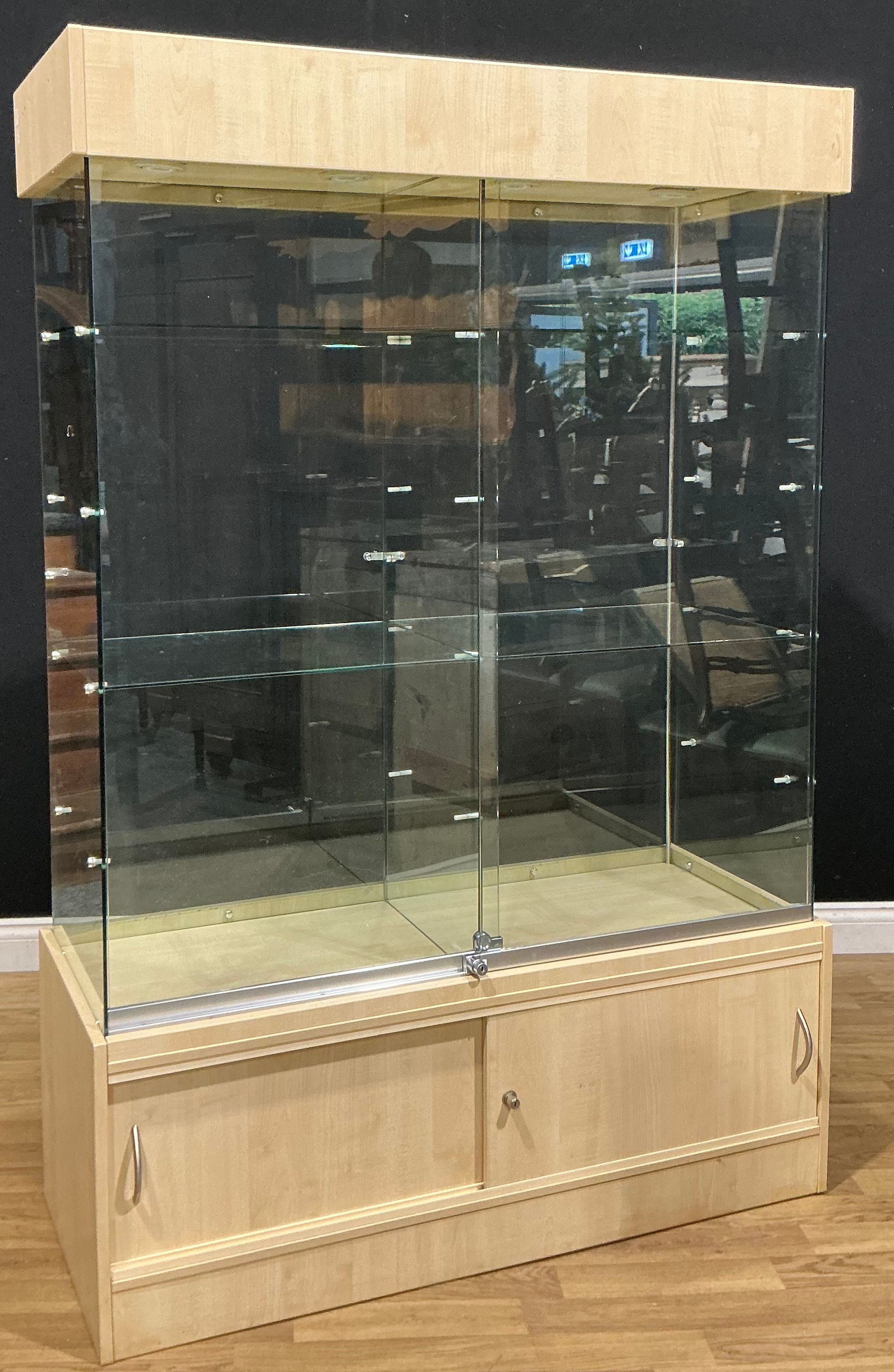 A contemporary shop display case, 179cm high, 120.5cm wide, 47cm deep