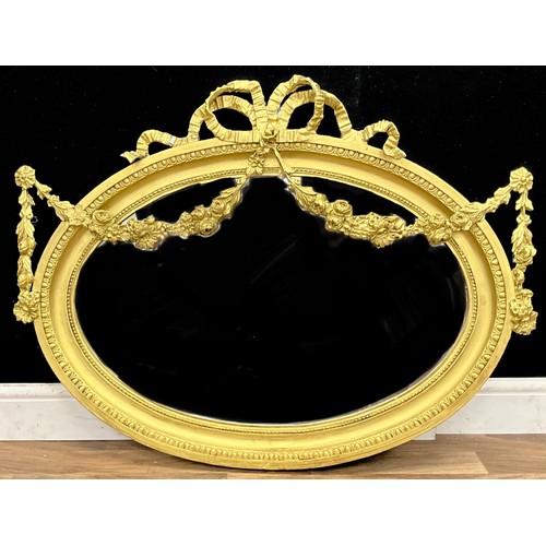 91 - A 19th century Adam Revival oval looking glass wall mirror, bevelled plate within ribbon bow and swa... 