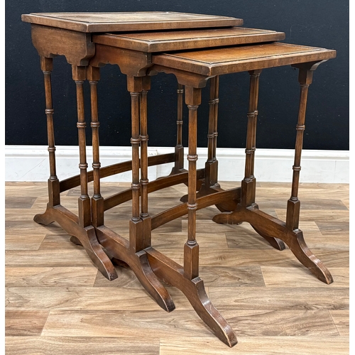 92 - A 19th century nest of three mahogany tables, rectangular tops with splaying legs, largest 60cm high... 