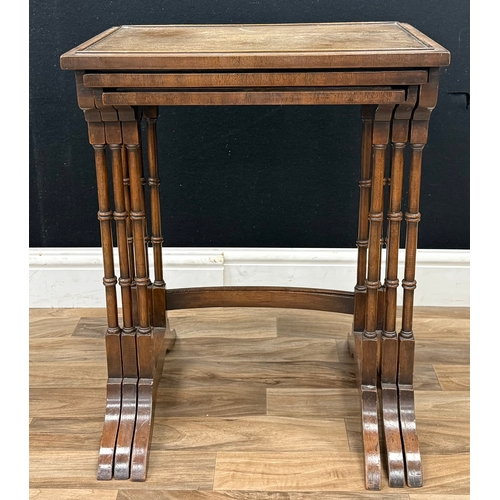 92 - A 19th century nest of three mahogany tables, rectangular tops with splaying legs, largest 60cm high... 