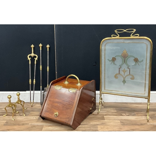 99 - A brass fire companion set including, shovel, tongs, poker, pair of fire dogs, a mahogany and brass ... 