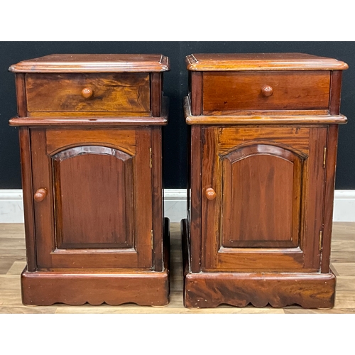101 - A pair of Victorian style mahogany bedside cabinets, single drawer above cupboard door with removabl... 
