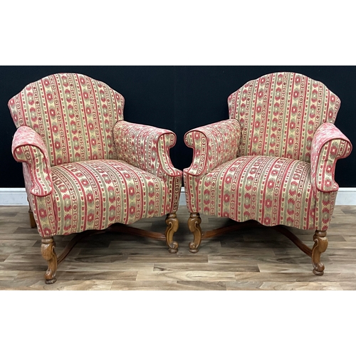 111 - A pair of 20th century Georgian style mahogany armchairs, decorative fabric, scrolling cabriole fron... 